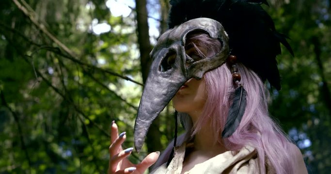 long purple haired girl takes off strange skull mask