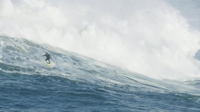 Aerial surfer riding wave Half Moon Bay Mavericks