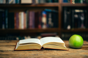 The book in the library (school, university, college) on the table. Learning and study concept. Copy space.