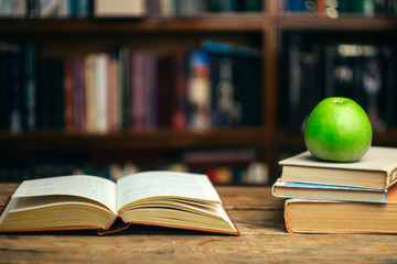 The book in the library (school, university, college) on the table. Learning and study concept. Copy space.
