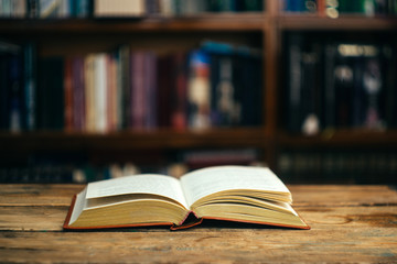 The book in the library (school, university, college) on the table. Learning and study concept. Copy space.