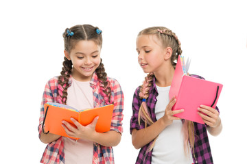 Reading skills. Cute small children holding books. Adorable little girls with school exercise...