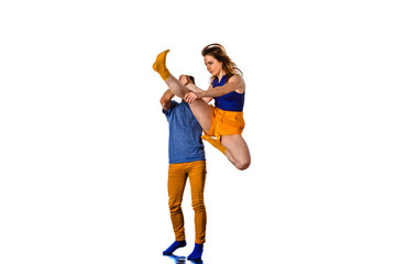 Two talented dancers practising in large studio