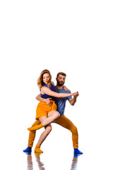 Young couple ballet dancing on white background