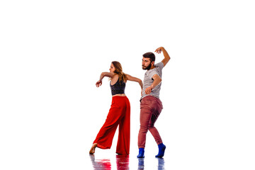 Two talented break dancers practicing together isolated on white