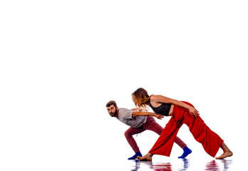 Two talented break dancers practicing together isolated on white