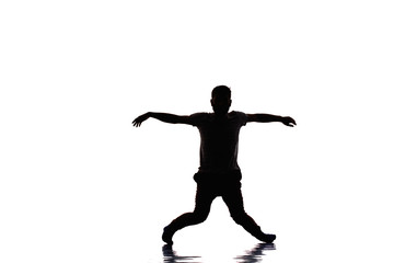 Fototapeta na wymiar Caucasian young man dance, full length portrait isolated
