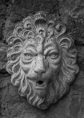 Fototapeta na wymiar Lion head stone sculpture fountain