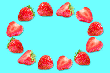 Flat lay composition with strawberry frame on a blue background