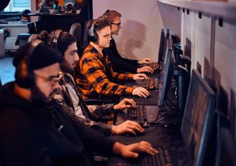 Busy team of gamers has an cyber championship with onother gamers.