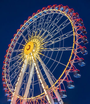 ferris wheel  at night in the summer