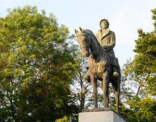 Old bronze statue of King Albert 1, third king of the belgians, on his horse surrounded by spring...