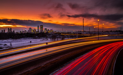 Fototapeta na wymiar Traffic during sunset with city