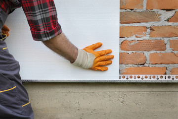 House renovation, polystyrene wall insulation, plate placing