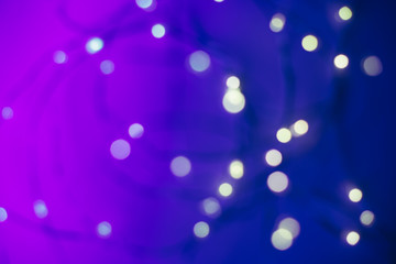 Blured background with led garland. Trendy neon colors with gradient.