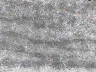 Rough dark stone background or texture pattern.
