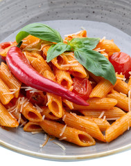 A wonderful Italian pasta dish in tomato with spinach and paprika.
