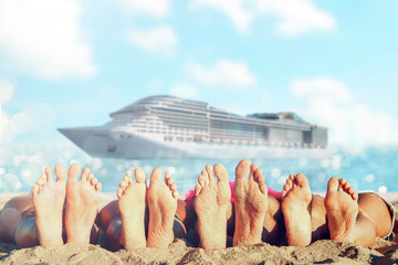 Group of friends having fun on the beach with their foots. Concept of summertime.