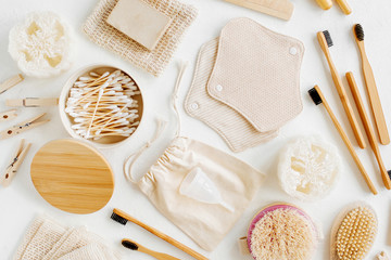 Zero waste supplies for personal hygiene. Eco Soap, bamboo toothbrush, reusable cloth menstrual pads, natural wooden brush. Sustainable lifestyle. Plastic free concept.