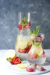 Cold summer drink with mint, strawberry and lemon