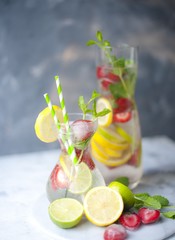 Cold summer drink with mint, strawberry and lemon