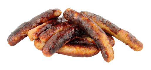 Group of grilled chipolata sausages isolated on a white background