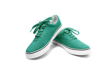 A pair of green canvas shoes isolated on white