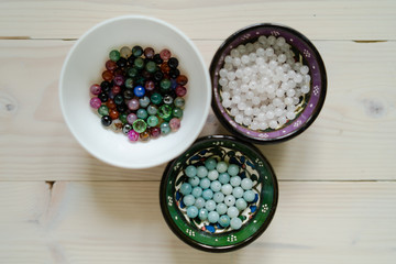 High angle view on crystal perls stones on wooden table