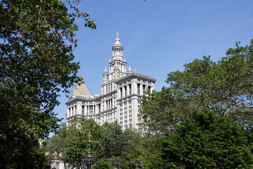 A park with a fountain near a Municipal Building in New York. Square in the big city on a summer day