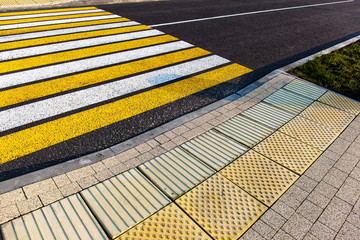 tactile tile for the blind before a pedestrian crossing on a city street