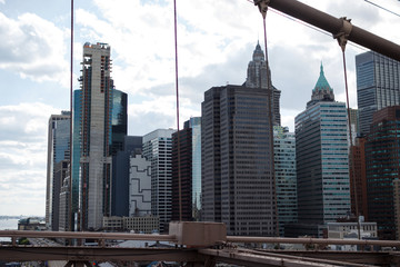 Naklejka premium New York, NY / USA - May/27/2019: View of New York skyscrapers from Brooklyn Bridge