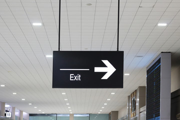 Exit light sign in the airport building.