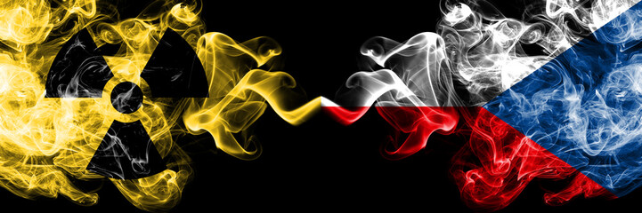 Czech Republic vs nuclear smoky mystic flags placed side by side. Thick colored silky smokes combination of Czech Republic flag and radioactive sign.