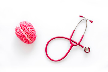 Brain functions concept with brain and stethoscope on white background top view