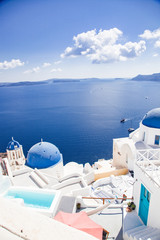 traditional blue doomed churches and white houses in Santorini, Cyclades islands Greece - amazing...