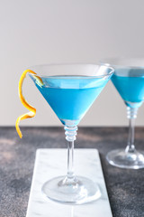 Glass of Blue Lagoon cocktail on table