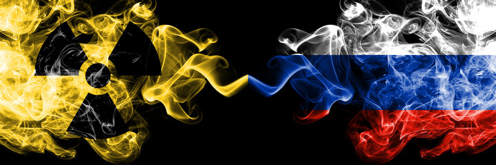 Russia, Russian vs nuclear smoky mystic flags placed side by side. Thick colored silky smokes combination of Russia, Russian flag and radioactive sign.