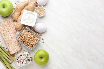 Different healthy food on light background
