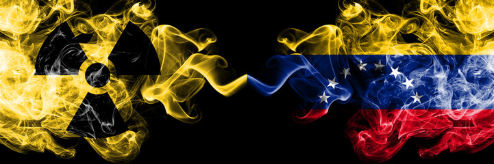 Venezuela, Venezuelan vs nuclear smoky mystic flags placed side by side. Thick colored silky smokes combination of Venezuela, Venezuelan flag and radioactive sign.