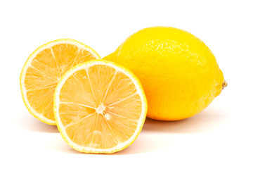 Whole and sliced half lemons isolated on white background.