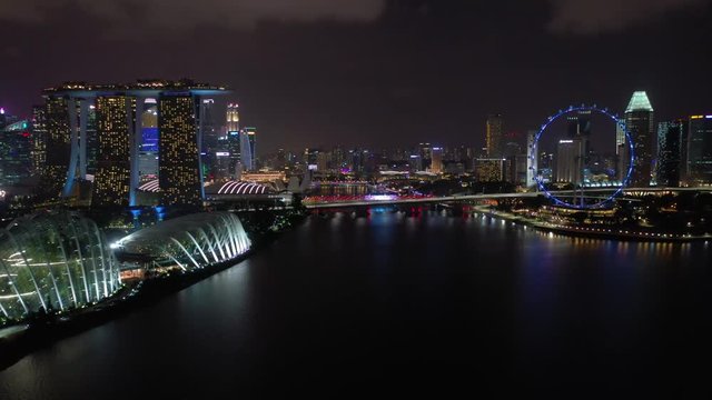 singapore city night time illumination famous marina riverside bay downtown aerial panorama 4k 