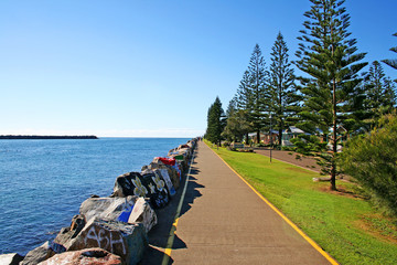 Walking along the painted rock path at Port Macquarie. Australia.