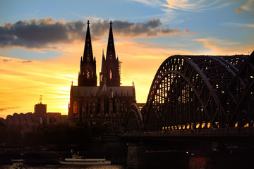Amazing sunset view on Cologne Cathedral and Hohenzollern Bridge in Koel, Germany