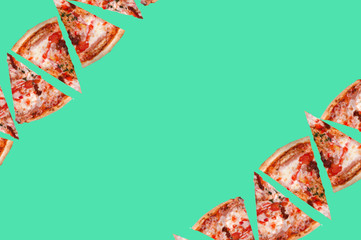 many slices of vegetarian pizza in the upper corner of the image and in the lower corner of the image on a green background top view