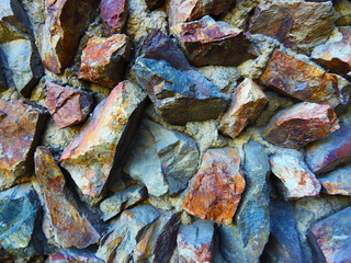 The wall is made of natural stones. Background. Texture.