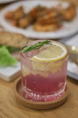 butterfly pea Mocktail with green mint and lime on wood table