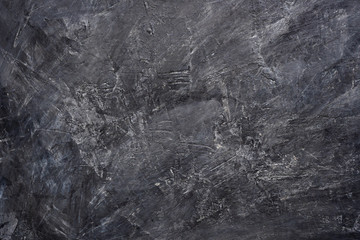 Naklejka premium Close up texture of black color painting on cement wall.