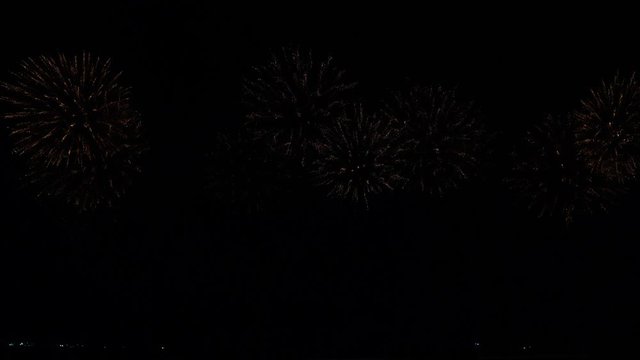 Fireworks or Holiday celebration concept : Colorful fireworks at holiday night. 4K UHD footage. Fantasy fireworks that are beautifully delighted on a black background