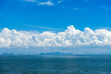 Naklejka premium Blue sky background with white clouds.