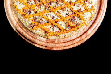 Half a pizza on top of a black background in close up